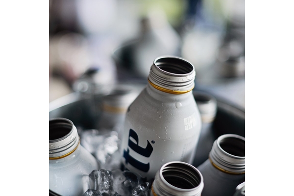 Image A miller lite aluminum bottle in an ice bucket.